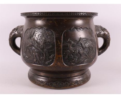 A brown patinated bronze cachepot or censer with elephants as ears, China, around 1900. Relief decor of, among others, deer i