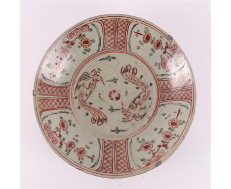 A porcelain Swatov dish, China, Ming, 17th century. Decoration of birds on the shelf, the lip with floral motifs in the plane
