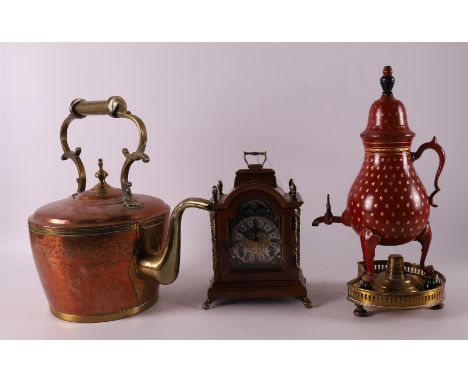 A red lacquered pewter tap jug with gold-coloured mille etoiles decor, on a brass brazier with ditto light. After an old exam