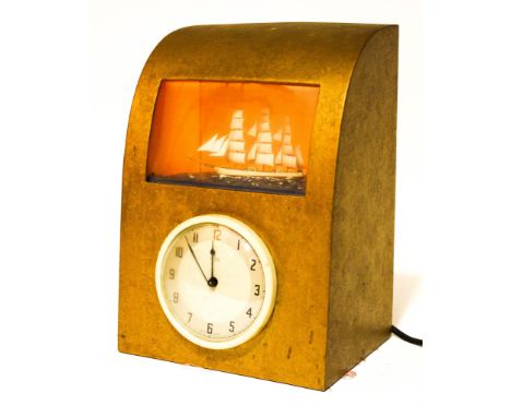 A Metamec mid-century mantle clock, inset with a galleon, with silver and cream dial, in a gilt D-shaped case, 32.5 cm wide, 