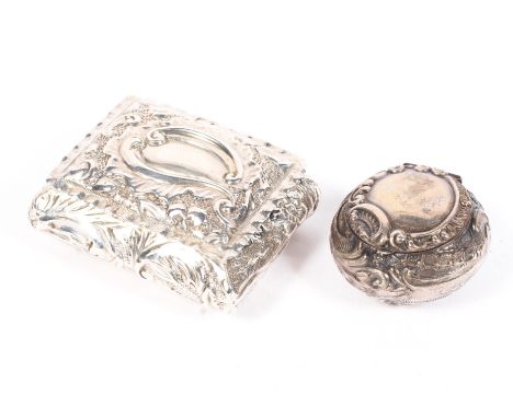 Two silver patch/snuff boxes, one of rectangular form with gilt interior, the other circular, both with highly embossed decor