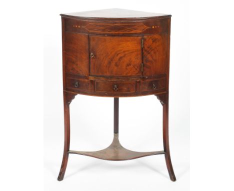 A Georgian mahogany wash stand, D-shaped, inlaid with satinwood stringing, with central cupboard above a drawer and two small