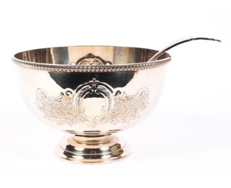 A silver plated punch bowl and ladle, the footed bowl cast with cartouches and diaper pattern panels and scrolls, 20th centur