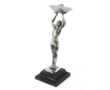 An Art Deco chromed metal figural table lamp, cast as a female nude, with 'Limousin' signature to canted square base, she sup