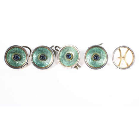 A set of four Art Deco French 18ct gold gents dress buttons, with green guilloche enamel bordered by a central cabochon sapph