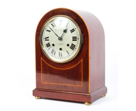 A 20th century mahogany dome topped mantel clock, the silvered dial with Roman numerals, marked 'Camerer Cuss &amp; Co 122 Hi