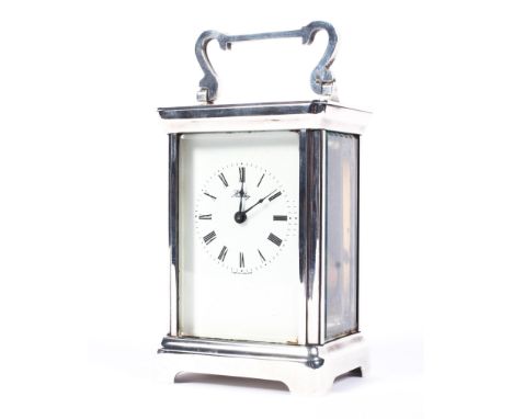 A Henley Carriage Clock Co. silver cased carriage clock, with key, hallmarked Birmingham, 1979, with white dial and black Rom