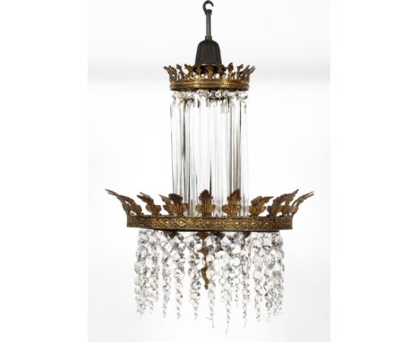 An early 20th century, double crown crystal chandelier with elongated three-sided droplets suspended from the smaller upper c