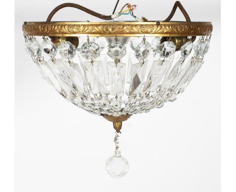 An early 20th century gilt-metal cut-glass bag chandelier, of domed form with acanthus and scroll cast gallery, suspending pe