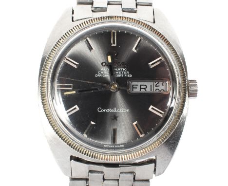 An Omega automatic chronometer constellation gents wristwatch, the silvered dial with baton hour markers, day/date aperture a