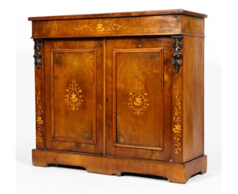 A Victorian walnut veneered marquetry sideboard, inlaid with satinwood tendrils surrounding an equestrian figure, with frieze