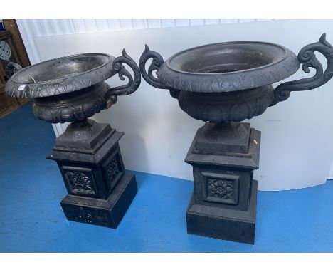 Pair of black cast iron garden urns on stands, 32"w x 39"h