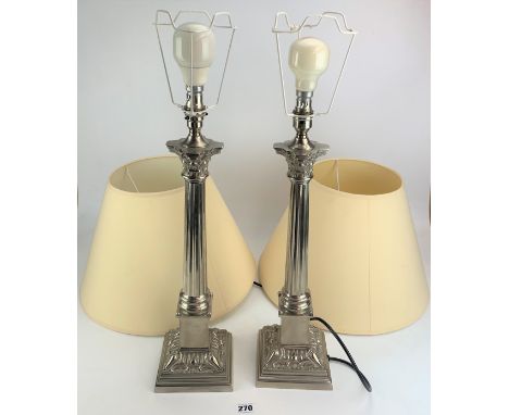 Pair of modern silver plated candlestick lamps by Valsam 24" to top of fitting with cream shades