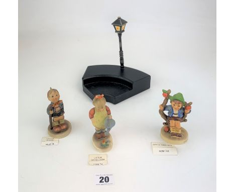 3 Hummel figures and stand- 'Lamplighter stand, (7.5"), 'Apple Tree Boy' 142, 'Little Hiker' 16 (4"), 'Little Gardener' 74