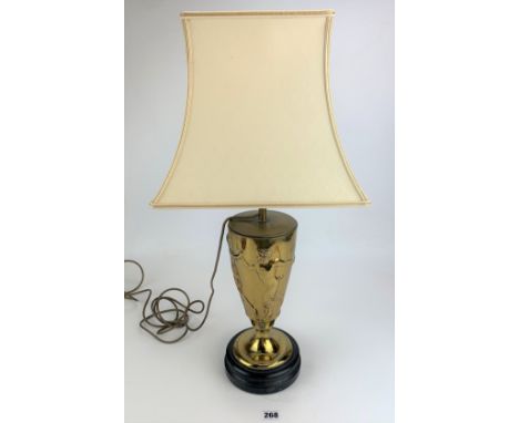 Brass table lamp with dancing figure relief and cream shade, total height 24" (needs rewiring)