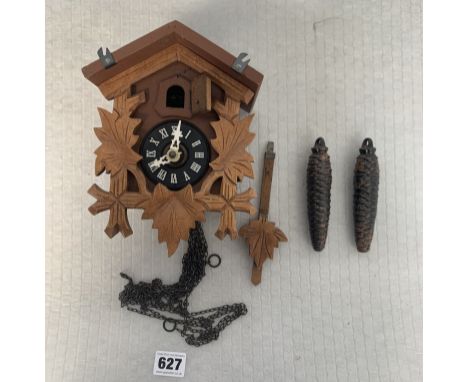 Small cuckoo clock with pendulum and 2 weights, 6" high