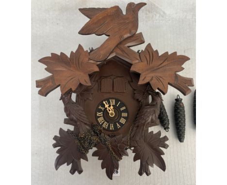 German cuckoo clock with cuckoo and figure, pendulum and 3 weights, 12" high plus top