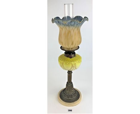 Brass and yellow glass oil lamp marked Youngs Special 16" high with yellow/blue fluted glass shade and funnel