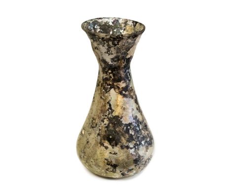 A large glass flask of the Roman period. It has a wide bulbous base narrowing to a small neck and then opening out to a wide 