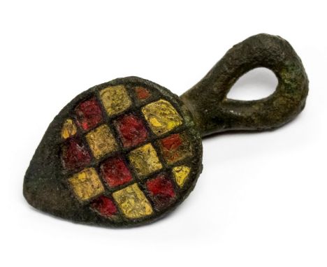 Late Iron age to early Roman button-and-loop fastener with a teardrop shaped head and red and yellow champlevé enamel decorat