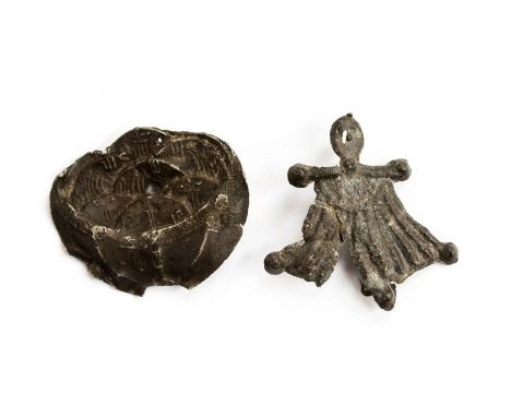 Two medieval secular purse badges. One badge in the form of a miniature purse with knobbed purse  bar, a type that was in use