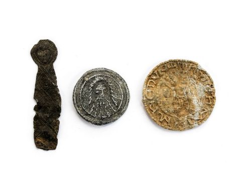 Three badges two lead, one pewter Pilgrims badge 14th Century. The first is the figure of Christ possibly a piece from a larg