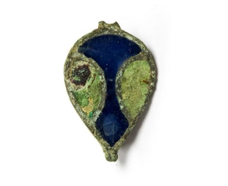 Roman piriform plate brooch decorated with a central panel of blue champleve enamel, with an oval panel of light green enamel