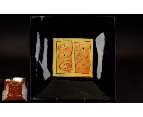 A Contemporary French Glazed Ceramic Charger Square wall charger with deep black glazed border with central modernist circula