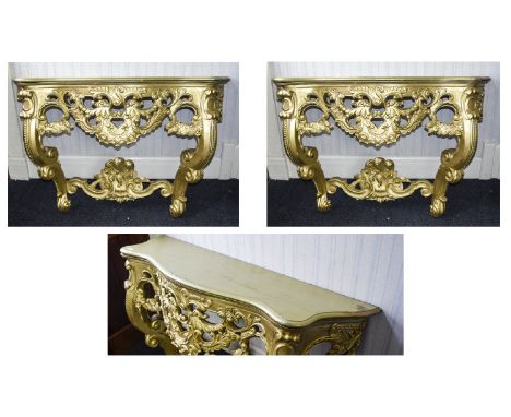 A Pair Of Ornate Console Tables Two reproduction Rococo hall/console tables with intricate apron and legs comprising scroll a