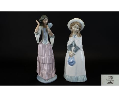 Nao by Lladro Figurines ( 2 ) In Total. Comprises 1/ Girl with Hand Mirror. 12 Inches In length. 2/ Young Girl Dressed For Th