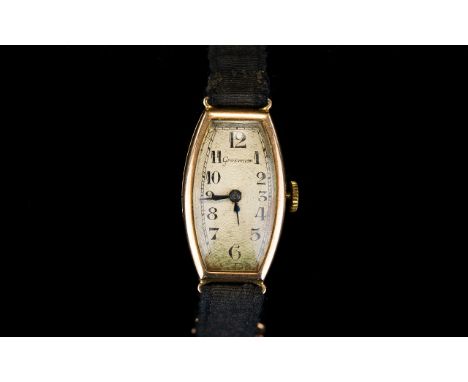 A Ladies 9ct Gold Vintage Dress Watch By Grosvenor Circa 1930's the 9ct case of lozenge form with cream ceramic dial. Origina