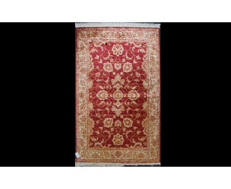 A Large Woven Silk Carpet Large Zeigler carpet, red ground with repeated red floral and foliate design and matching red and p