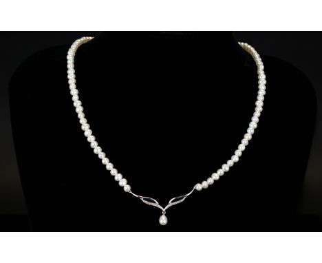 9ct Diamond Set Pearl Necklace Collar style necklace with central v-shaped station set with diamond chips and pearl drop