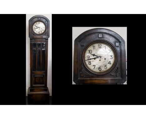 A Westminster Chime Granddaughter Clock Oak Cased With Silvered Dial And Arabic Numerals. Height Approx 17 Inches. 