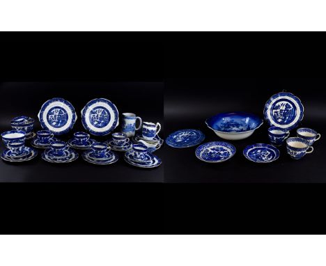 A Large Collection Of Willow Pattern Serve Ware Over forty items in total to include trivet, jug, several cups and saucers, s