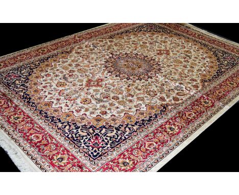 A Very Large Woven Silk Carpet Keshan rug with beige ground and traditional Middle Eastern floral and foliate border detail w