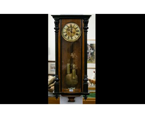 Walnut Cased Vienna Wall Clock, Cream Chapter Dial With Roman Numerals and subsidiary seconds, ebonised pillars, glazed front