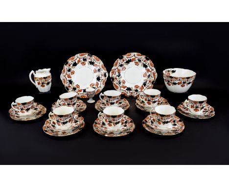 Staffordshire Part Teaset comprising 8 cups, saucers and side plates, a large sugar bowl and milk jug and two sandwich/cake p