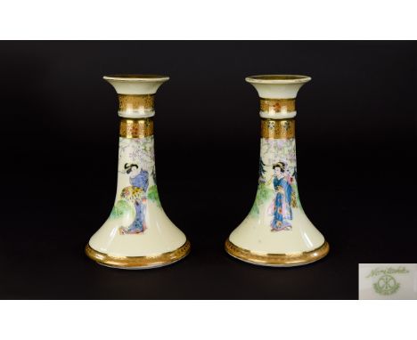 Noritake Vintage Candlesticks A pair of Oriental design short ceramic candlesticks with Geisha decoration to body and gilt tr