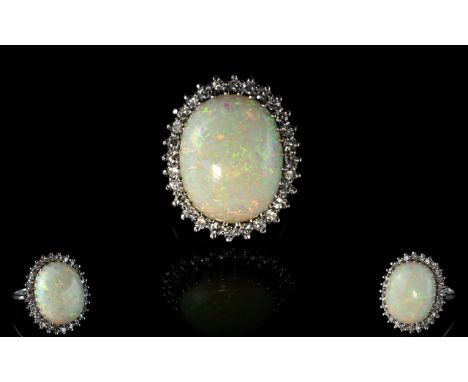 Ladies 18ct White Gold Impressive Opal and Diamond Dress Ring. The Large Opal of Pinks, Reds and Blues. Est 12 cts In Weight.