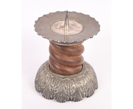 A turned oak candlestick with barley twist stem and silver mounts