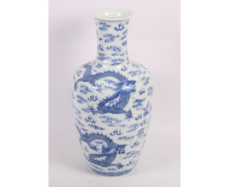 A Chinese porcelain dragon cloud scroll decorated vase with flared rim, 13" high, a double gourd vase, 7" high, a smaller sim