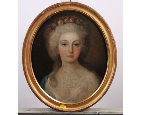 An 18th Century oval oil on canvas, portrait of an unknown woman with flowers in her hair, 15" x 12", in oval gilt frame (cle