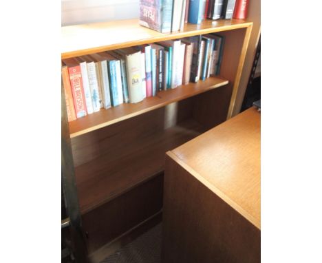 A 1960s light teak open bookcase with cupboards below, 36" wide