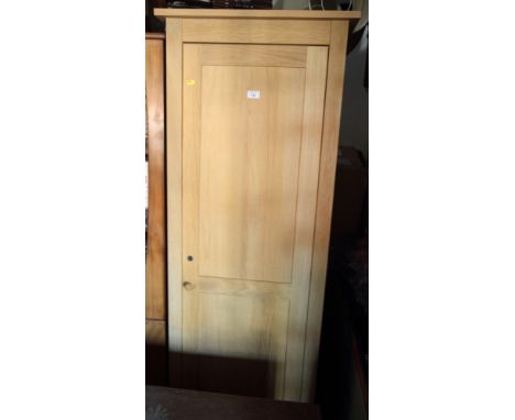 A light oak hall wardrobe enclosed panelled door, 24" wide