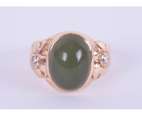 A 14ct jade and diamond set ring in yellow gold, size H.