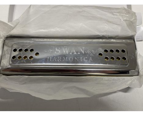 A boxed Swan harmonica 