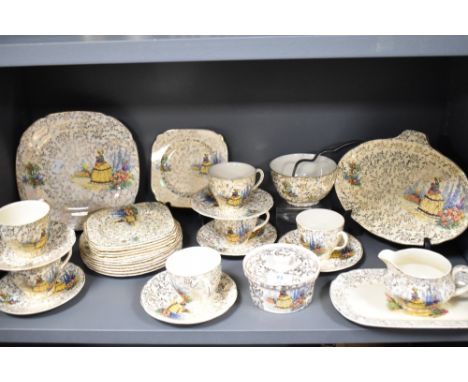 A partial tea service having crinoline lady and garden scenes with gilt detailing, plates, cups and saucers, jug and more to 