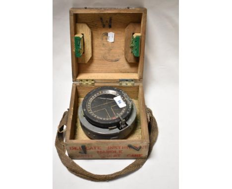 A WW2 British military gimble compass in wooden case, undated, earliest stamp service date reads 1940.