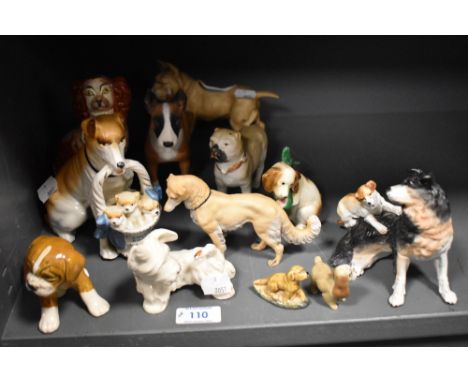 A mixed lot of vintage dog studies, including Beswick West Highland terrier, Hummel dog nursing paw with early bee symbol to 